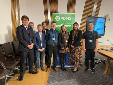 Alex and Pam Gosal MSP stand and pose with current and past recipients of the prestigious Young Software Engineer of the Year Awards.